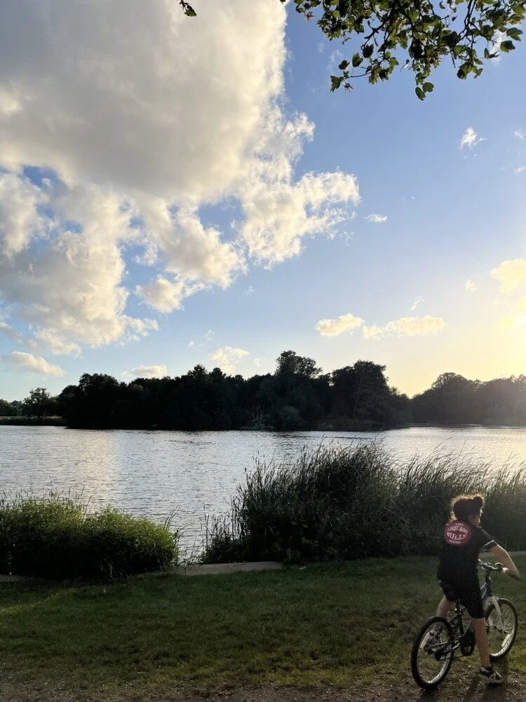 Riding by a lake at sunset
