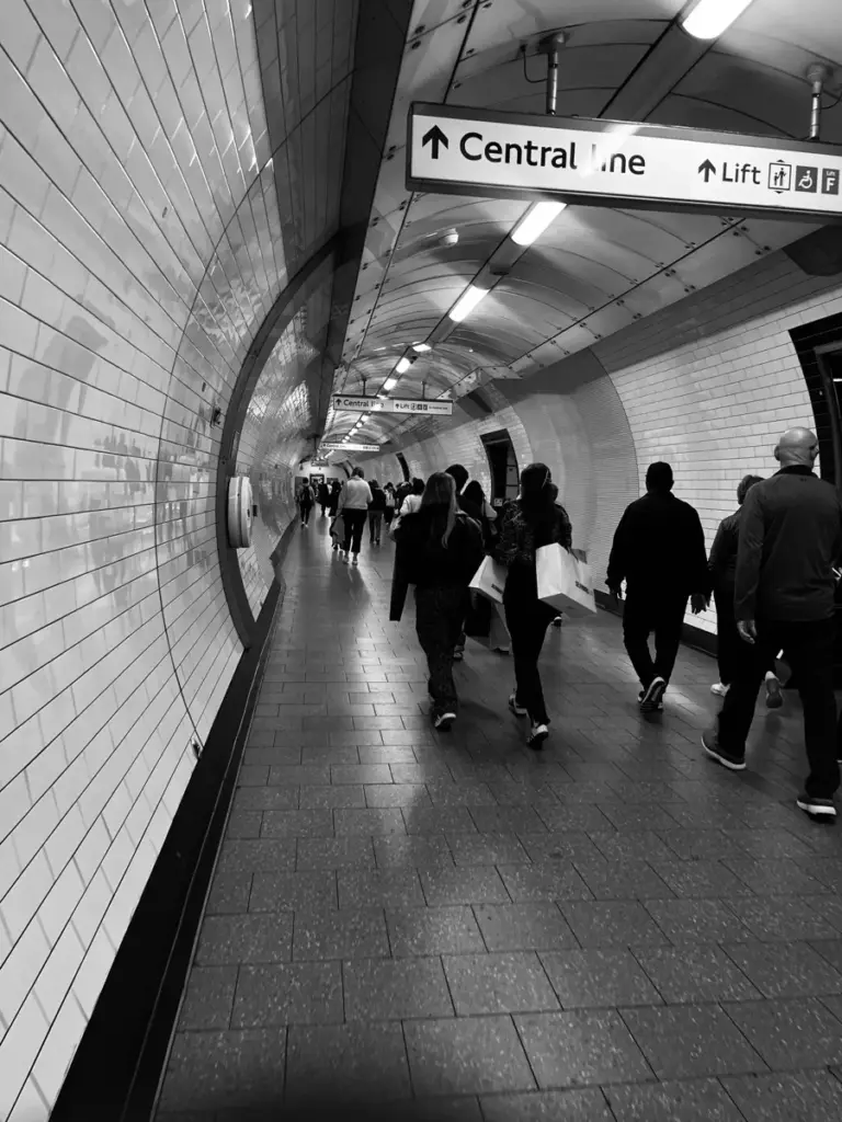Black and white shot down a curved Central line tunnel on the London Underground